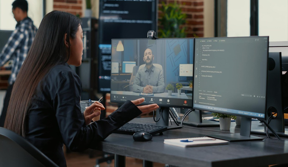 Employee discussing data protection strategies over a video call in a remote work setting.