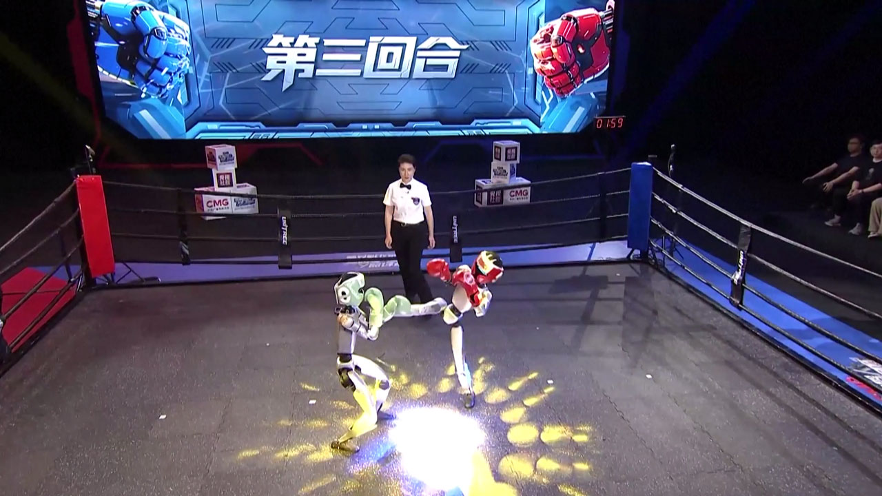 Two robots fight on stage during the world's first humanoid robot fighting competition, Hangzhou City, east China's Zhejiang Province, May 25, 2025. /China Media Group