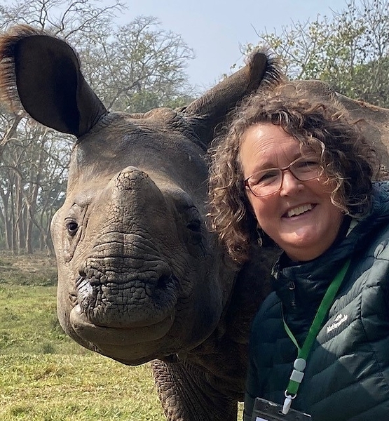 Professor Wendy Wright takes a selfie with an orphaned one-horned rhinoceros at Chitwan National Park, Nepal.